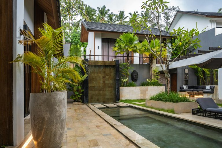 A house with a pool in the middle of it