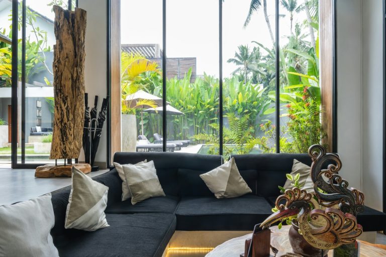 A living room filled with furniture and lots of windows